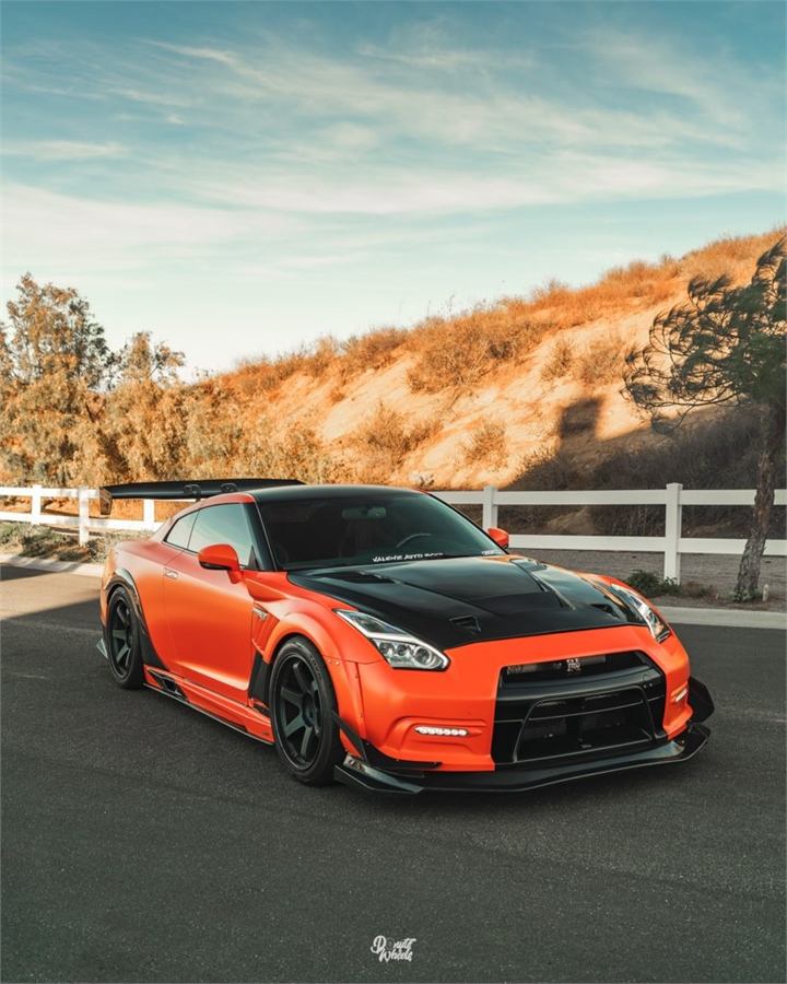 Orange car featured on the Valenz Autobody homepage
